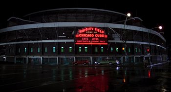 Movie still from “The Blues Brothers” (1980), directed by John Landis – A baseball stadium lit up at night in the rain; Extreme Wide shot, High angle