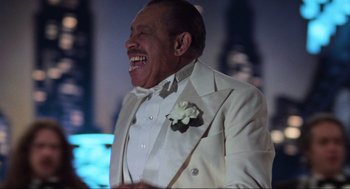 Movie still from “The Blues Brothers” (1980), directed by John Landis – An older man in a white suit laughing; Close Up shot, Low angle