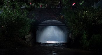Movie still from “The Blues Brothers” (1980), directed by John Landis – A tunnel with a light shining through it; Extreme Wide shot, High angle