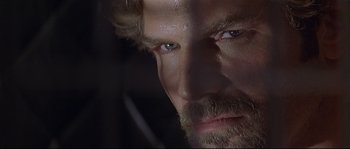 Movie still from “Con Air” (1997), directed by Simon West – A man's face with a beard; Close Up shot, Low angle