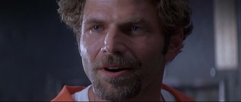 Movie still from “Con Air” (1997), directed by Simon West – A person with a beard; Close Up shot, Low angle