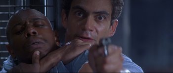 Movie still from “Con Air” (1997), directed by Simon West – A person brushing his teeth; Close Up shot, Low angle