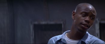 Movie still from “Con Air” (1997), directed by Simon West – A man with his head turned to the side; Close Up shot, Low angle