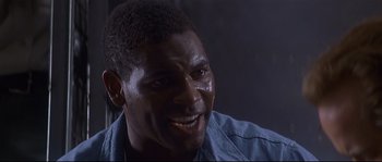 Movie still from “Con Air” (1997), directed by Simon West – A person with a crying face; Close Up shot, Low angle