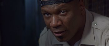 Movie still from “Con Air” (1997), directed by Simon West – A person wearing a helmet; Close Up shot, Low angle