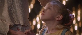 Movie still from “Con Air” (1997), directed by Simon West – A young girl looking up into the sky; Close Up shot, Low angle