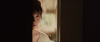 Movie still from “The Boogeyman” (2023), directed by Rob Savage – A young woman looking out of a window at the camera; Close Up shot, Over the shoulder angle