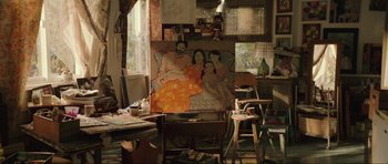 Movie still from “The Boogeyman” (2023), directed by Rob Savage – A painting of a family sitting on a couch in the middle of a room; Wide shot, High angle