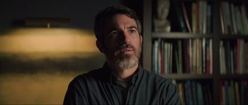 Movie still from “The Boogeyman” (2023), directed by Rob Savage – A person with a beard; Close Up shot, Over the shoulder angle