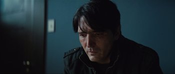 Movie still from “The Boogeyman” (2023), directed by Rob Savage – A person wearing a black jacket; Close Up shot, Low angle