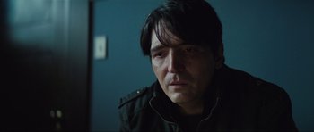 Movie still from “The Boogeyman” (2023), directed by Rob Savage – A person wearing a black jacket; Close Up shot, Over the shoulder angle