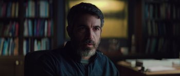 Movie still from “The Boogeyman” (2023), directed by Rob Savage – A person with a beard looking at the camera; Close Up shot, Over the shoulder angle