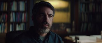 Movie still from “The Boogeyman” (2023), directed by Rob Savage – A person with a beard looking at the camera; Close Up shot, Over the shoulder angle