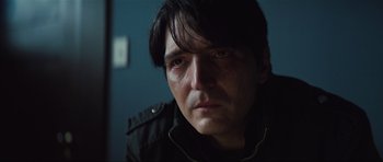 Movie still from “The Boogeyman” (2023), directed by Rob Savage – A person wearing a black jacket; Close Up shot, Over the shoulder angle