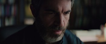 Movie still from “The Boogeyman” (2023), directed by Rob Savage – A person with a beard; Close Up shot, Over the shoulder angle