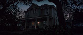 Movie still from “The Boogeyman” (2023), directed by Rob Savage – A house that is lit up at night time; Extreme Wide shot, Low angle