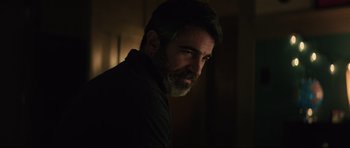 Movie still from “The Boogeyman” (2023), directed by Rob Savage – A man with a goatee and a beard; Close Up shot, Over the shoulder angle