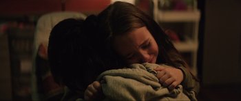 Movie still from “The Boogeyman” (2023), directed by Rob Savage – A young girl is crying while holding a blanket; Close Up shot, High angle