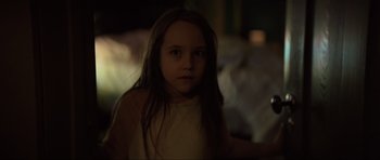 Movie still from “The Boogeyman” (2023), directed by Rob Savage – A little girl with long dark hair is looking at the camera; Close Up shot, Over the shoulder angle