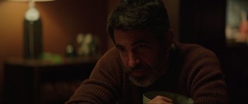 Movie still from “The Boogeyman” (2023), directed by Rob Savage – A person holding a cup of coffee; Close Up shot, Over the shoulder angle