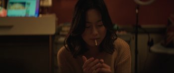 Movie still from “The Boogeyman” (2023), directed by Rob Savage – A woman is smoking a cigarette in a room; Close Up shot, Low angle