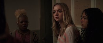 Movie still from “The Boogeyman” (2023), directed by Rob Savage – A young woman standing next to a mirror; Close Up shot, Over the shoulder angle