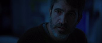 Movie still from “The Boogeyman” (2023), directed by Rob Savage – A person with a beard; Close Up shot, Over the shoulder angle