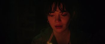 Movie still from “The Boogeyman” (2023), directed by Rob Savage – A young woman is crying in a dark room; Close Up shot, Over the shoulder angle