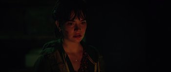 Movie still from “The Boogeyman” (2023), directed by Rob Savage – A young woman in a dark room with dark lighting; Close Up shot, Over the shoulder angle