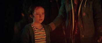 Movie still from “The Boogeyman” (2023), directed by Rob Savage – A young girl is standing in front of a wall; Close Up shot, Over the shoulder angle