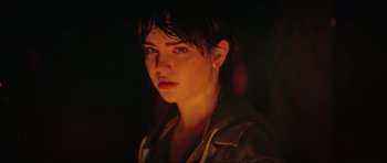 Movie still from “The Boogeyman” (2023), directed by Rob Savage – A woman is looking at the camera in the dark; Close Up shot, Over the shoulder angle