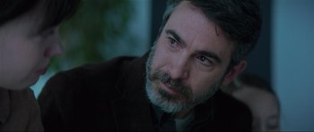 Movie still from “The Boogeyman” (2023), directed by Rob Savage – A person with a beard; Close Up shot, Over the shoulder angle