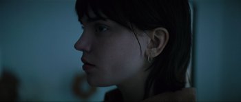 Movie still from “The Boogeyman” (2023), directed by Rob Savage – A person wearing a earring; Close Up shot, Over the shoulder angle