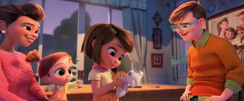 Movie still from “The Boss Baby 2: Family Business” (2021), directed by Tom McGrath – A girl holding a stuffed animal while standing next to a window; Medium shot, Over the shoulder angle