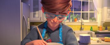 Movie still from “The Boss Baby 2: Family Business” (2021), directed by Tom McGrath – A person with glasses is painting a bowl; Close Up shot, Over the shoulder angle
