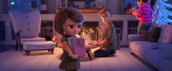 Movie still from “The Boss Baby 2: Family Business” (2021), directed by Tom McGrath – A girl and a boy sitting in front of a fireplace; Medium shot, Over the shoulder angle