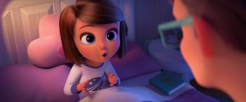 Movie still from “The Boss Baby 2: Family Business” (2021), directed by Tom McGrath – A cartoon girl is looking surprised at a book; Medium shot, Over the shoulder angle