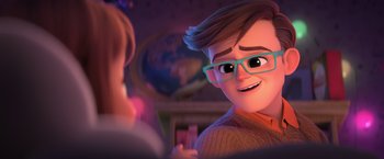 Movie still from “The Boss Baby 2: Family Business” (2021), directed by Tom McGrath – A man with glasses is smiling at the camera; Close Up shot, Over the shoulder angle