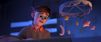 Movie still from “The Boss Baby 2: Family Business” (2021), directed by Tom McGrath – A cartoon of a boy looking at a laptop; Medium shot, Over the shoulder angle