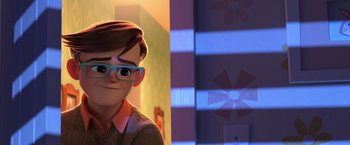 Movie still from “The Boss Baby 2: Family Business” (2021), directed by Tom McGrath – A boy with glasses is standing in front of a window; Close Up shot, Over the shoulder angle