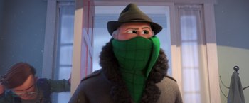 Movie still from “The Boss Baby 2: Family Business” (2021), directed by Tom McGrath – A man in a hat and coat with a green scarf on his face; Close Up shot, Over the shoulder angle