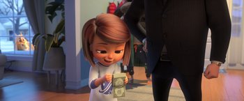 Movie still from “The Boss Baby 2: Family Business” (2021), directed by Tom McGrath – A cartoon girl holding a dollar bill in front of a man; Close Up shot, Over the shoulder angle