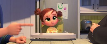 Movie still from “The Boss Baby 2: Family Business” (2021), directed by Tom McGrath – A cartoon girl sitting in a high chair; Medium shot, High angle