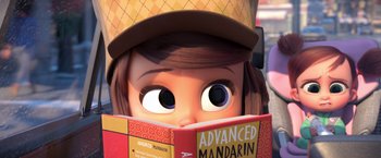 Movie still from “The Boss Baby 2: Family Business” (2021), directed by Tom McGrath – An animated character is reading a book; Close Up shot, High angle