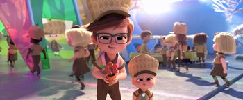 Movie still from “The Boss Baby 2: Family Business” (2021), directed by Tom McGrath – A boy and a girl are standing next to each other; Medium shot, Over the shoulder angle