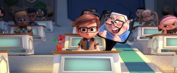 Movie still from “The Boss Baby 2: Family Business” (2021), directed by Tom McGrath – A cartoon of a boy with glasses sitting at a computer desk; Medium shot, Over the shoulder angle