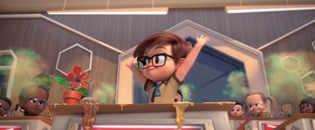 Movie still from “The Boss Baby 2: Family Business” (2021), directed by Tom McGrath – An animated boy with glasses is standing on a ledge; Medium shot, Low angle