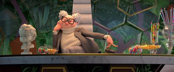 Movie still from “The Boss Baby 2: Family Business” (2021), directed by Tom McGrath – An old man is sitting in a chair; Medium shot, Over the shoulder angle