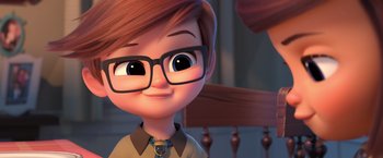 Movie still from “The Boss Baby 2: Family Business” (2021), directed by Tom McGrath – A boy with glasses is looking at the camera; Close Up shot, Over the shoulder angle