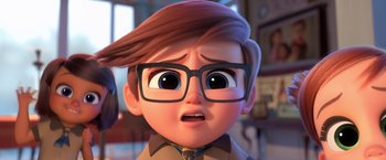 Movie still from “The Boss Baby 2: Family Business” (2021), directed by Tom McGrath – An animated boy wearing glasses looking surprised; Close Up shot, Over the shoulder angle